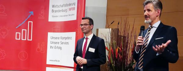 Geschäftsführung Dr. Steffen Kammradt und Sebastian Saule bei einer Veranstaltung
